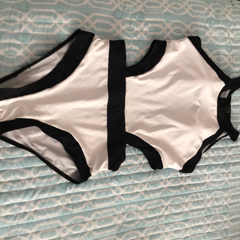A black and white one piece